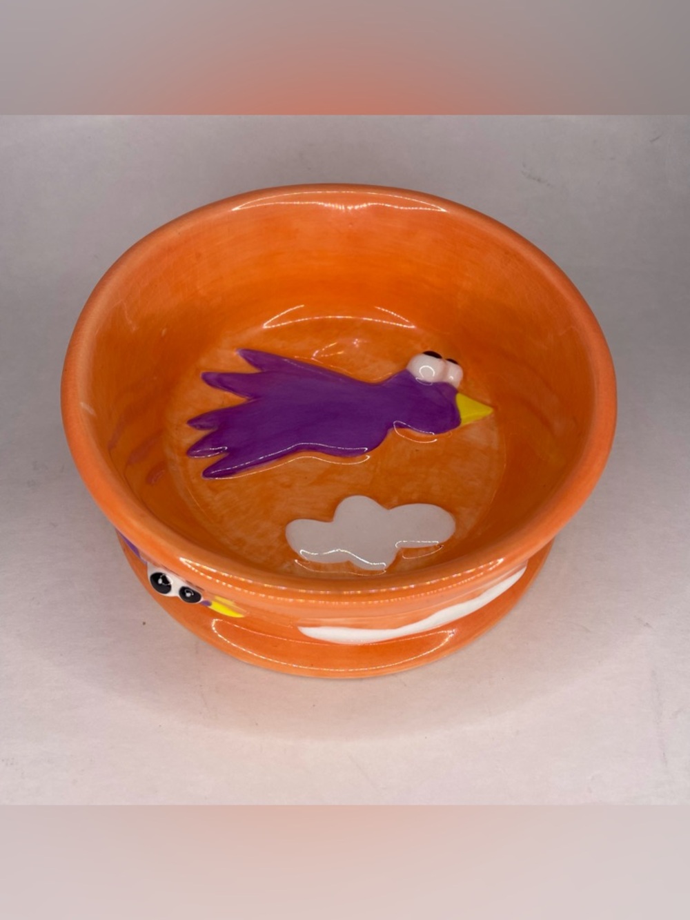 CERAMIC RUSS “BRITE SPOTS” DOG/CAT ORANGE BOWL SIGNED BY DEBBY CARMAN 5”